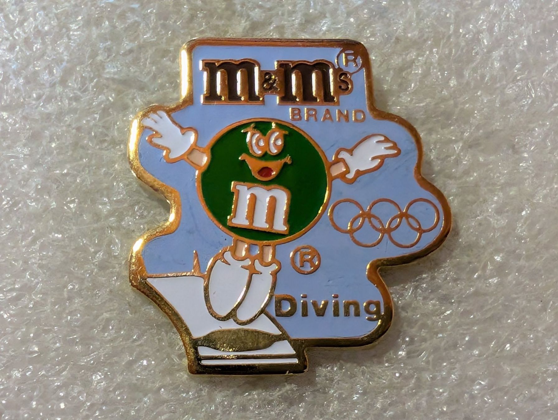 Placchette & Badge: Ansteckpin 200: m&m's x Olympia – Usato da Oppligen venduto da Pin-Fall-Shop