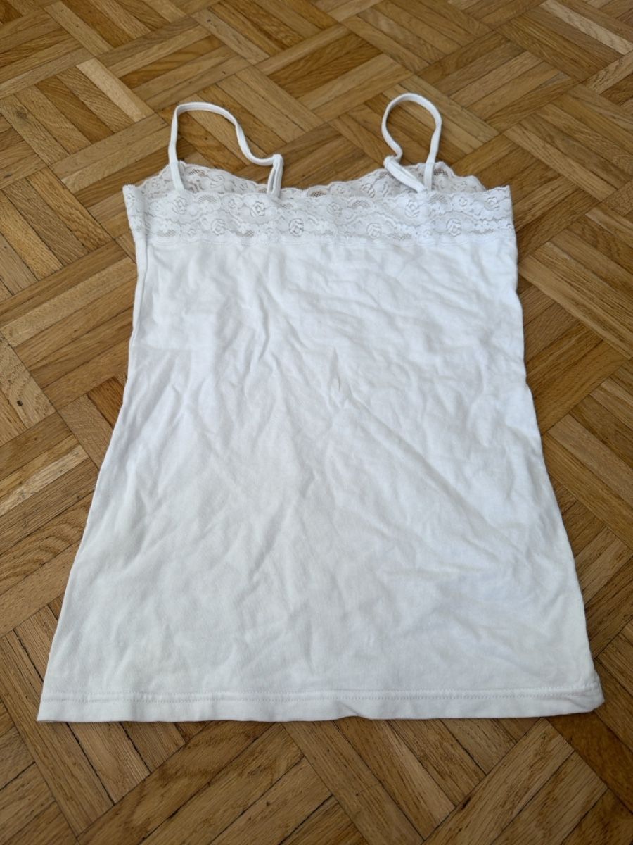 Top: Top blanc MIGROS  – Usato da Le Locle venduto da Mayd_h 1