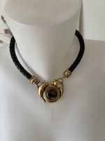 Collier cuir tressé noir dauphins et pierre ambré très bon e