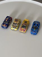 4 petites voitures Disney Burago made Italia