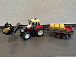 Bruder Steyr Traktor mit Frontlader und Bordwandanhänger