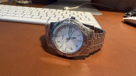 Montre M-Watch day-date en parfait état de marche