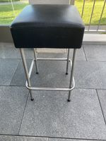 Black bar stool with metal frame