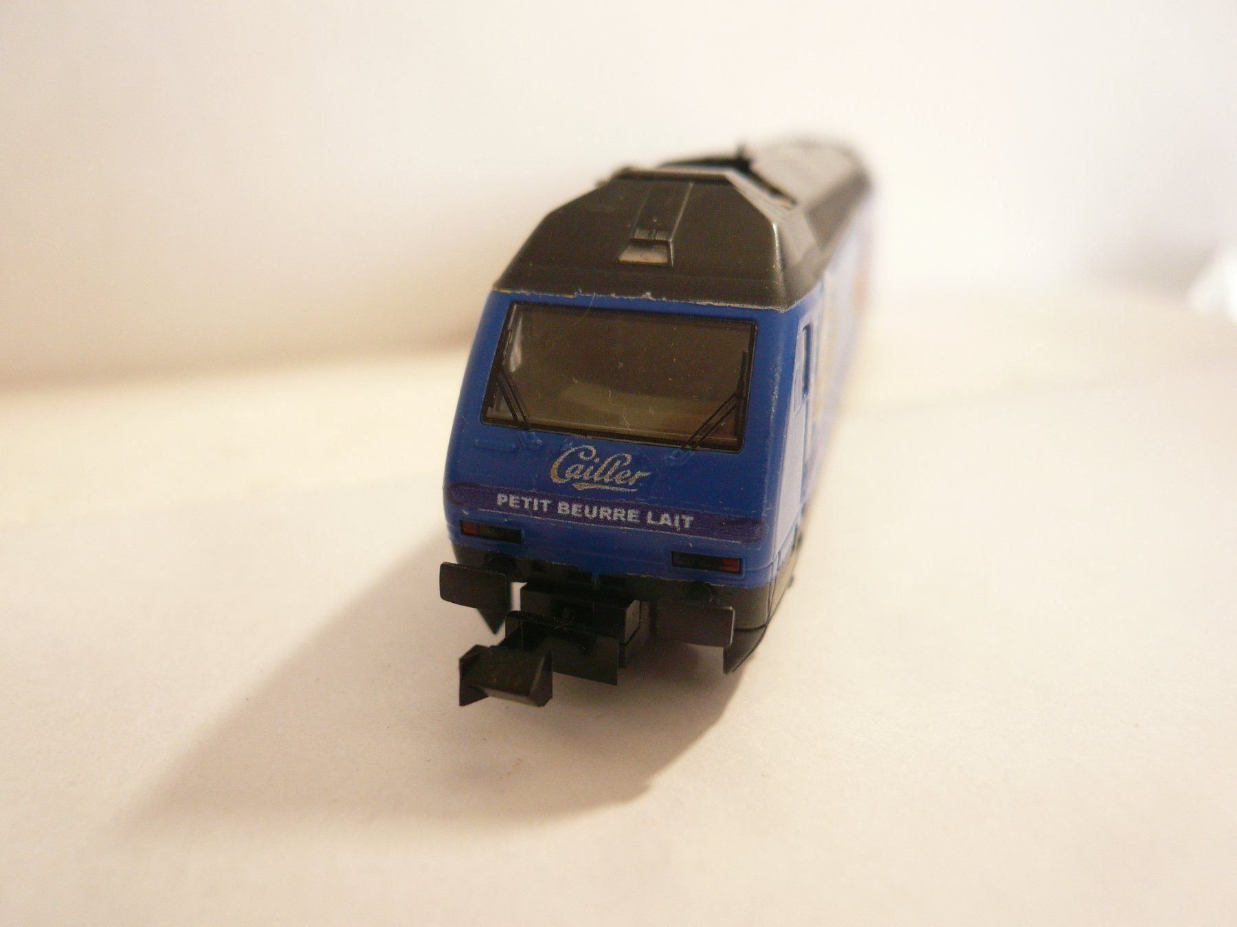 Trix Modelleisenbahnen: MINITRIX RE 460   "  CAILLER NOISETTES KAMBLY  " – Neu und originalverpackt aus Pfaffnau von nolff 1
