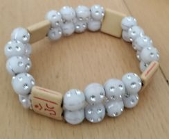 11). Armband