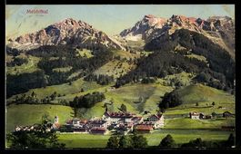 AK Melchthal, Ortspanorama mit Gebirge