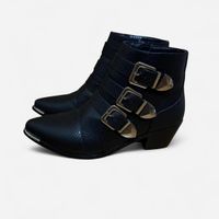 Black ankle boots with silver buckles