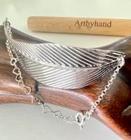Erlesener Blickfang:  Silberarmband 925 mit imposanter Feder