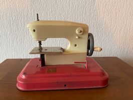 Machine à coudre vintage pour enfant 1960, rouge et crème