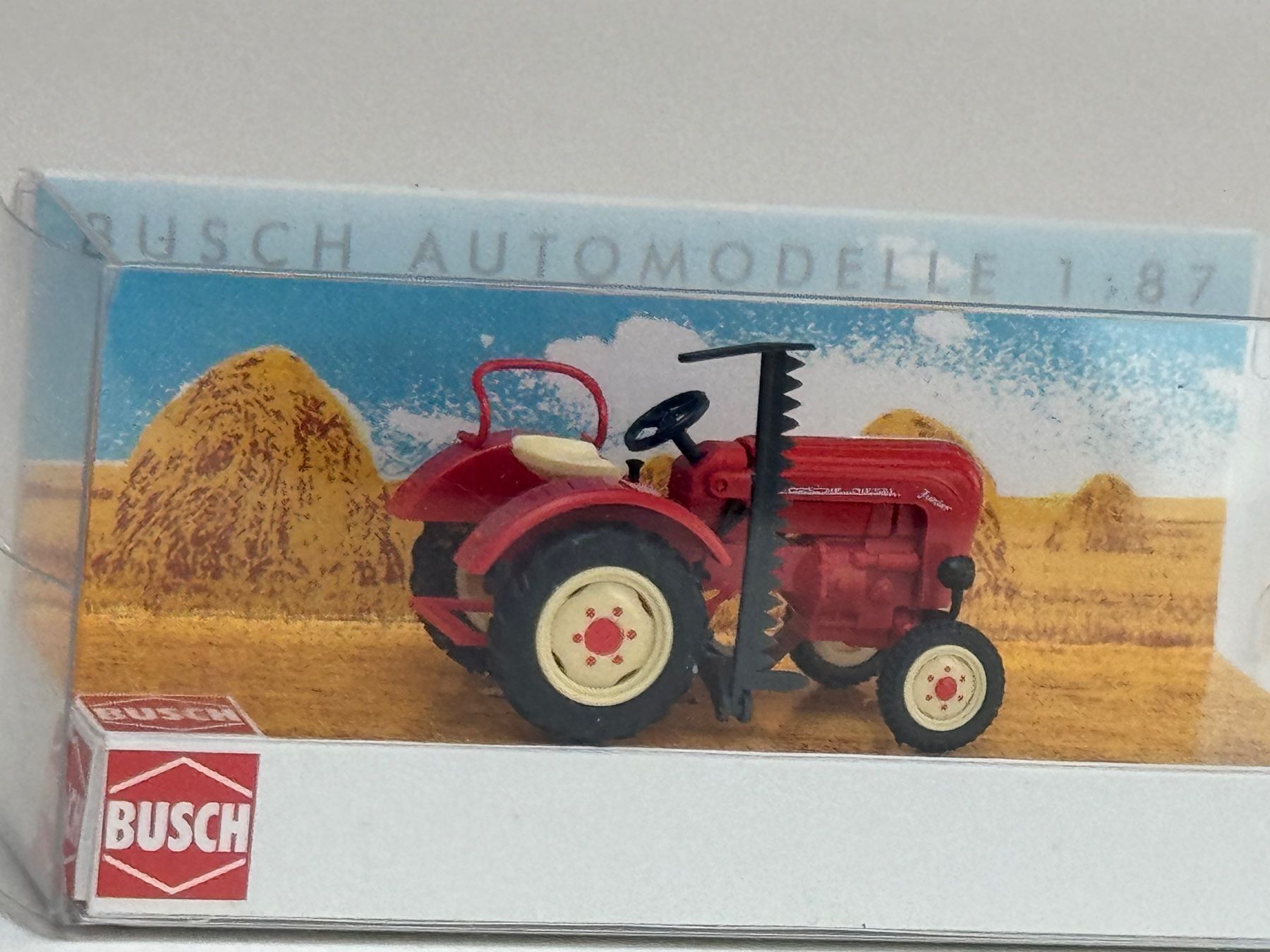 Busch Modellini d'auto: CH- Busch Porsche Schlepper mit Mähbalken – Usato da Elm venduto da Wikmtz