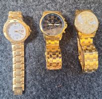 DREI GOLDENE ARMBANDUHREN