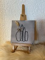 Tableau brodé avec vase et fleur état neuf complet