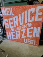 Grosses Werbeschild "Service am Herzen" 