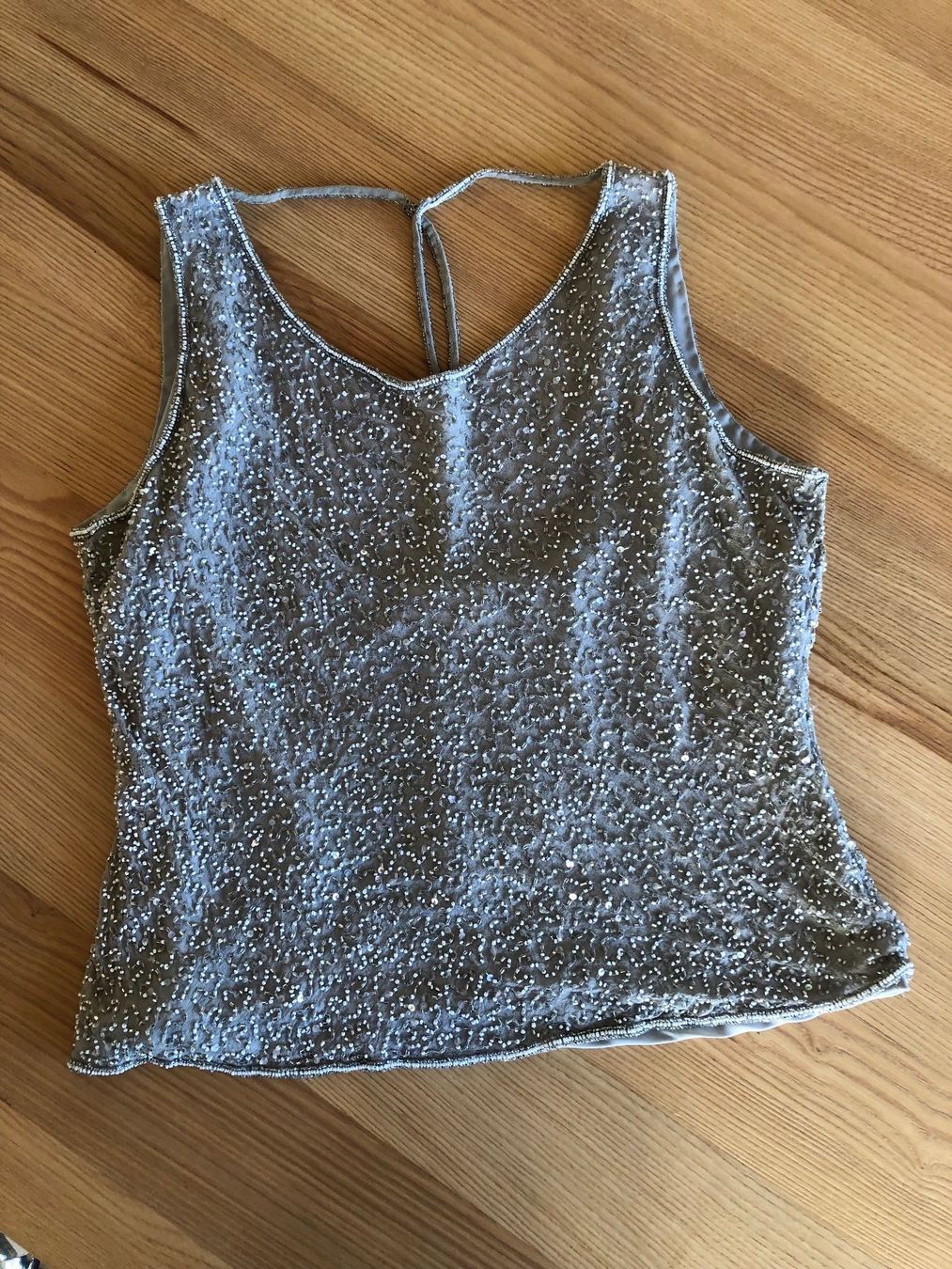 Top: Top grigio/argento Mis.42/44 IT – Usato da Davesco-Soragno venduto da dvf_7h6d