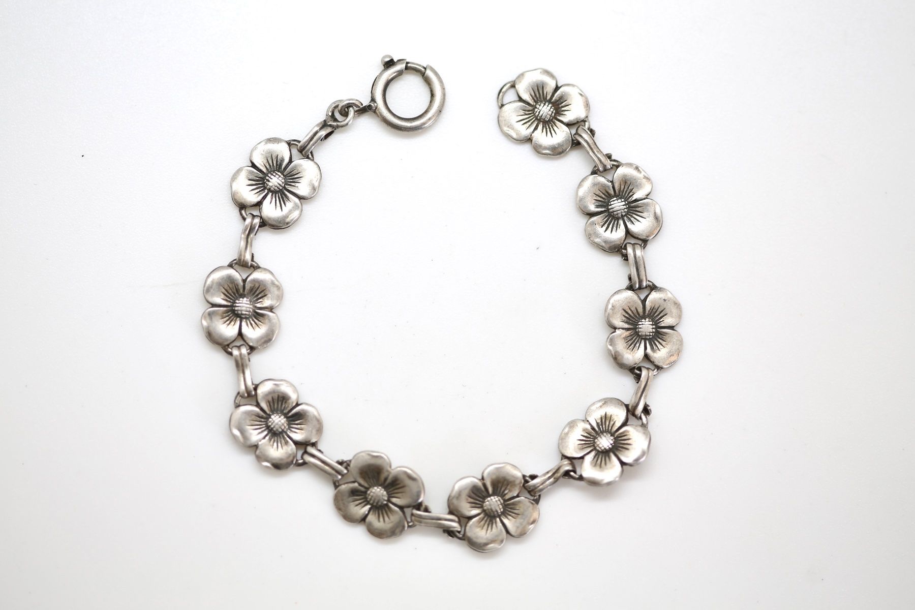 Bracciali & Braccialetti: Silber Armkette mit Blumenmotiven – Usato da Reinach BL venduto da Han-Numismatik