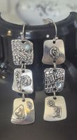 Orecchini argento design geometrico con pietre azzurre