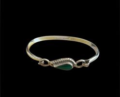 Silver bracelet with green gem stone