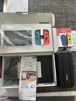 Nintendo Switch Konsole mit 4 Joy-Cons und Tasche