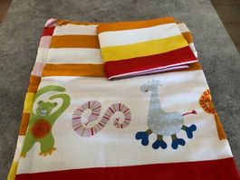 Parure de lit animaux multicolore 60x120 cm peu employé.