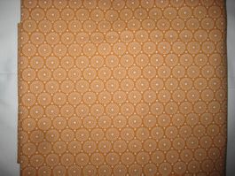 Baumwollstoff orange mit weissen runden Retromotiven