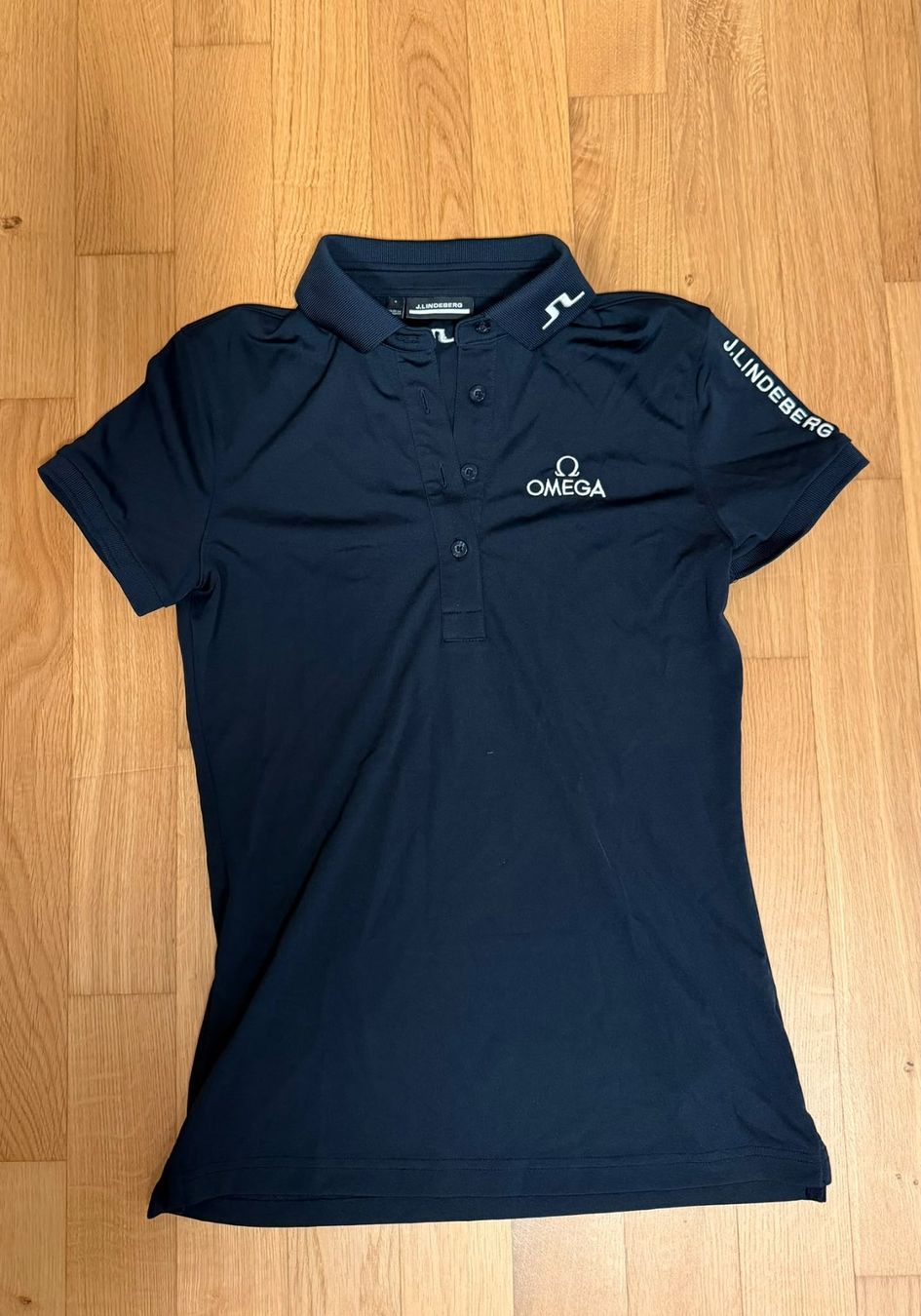 Lindeberg Magliette Polo: Polo de Golf Lindeberg OMEGA – Usato da Pieterlen venduto da Upcycle_switzerland 1