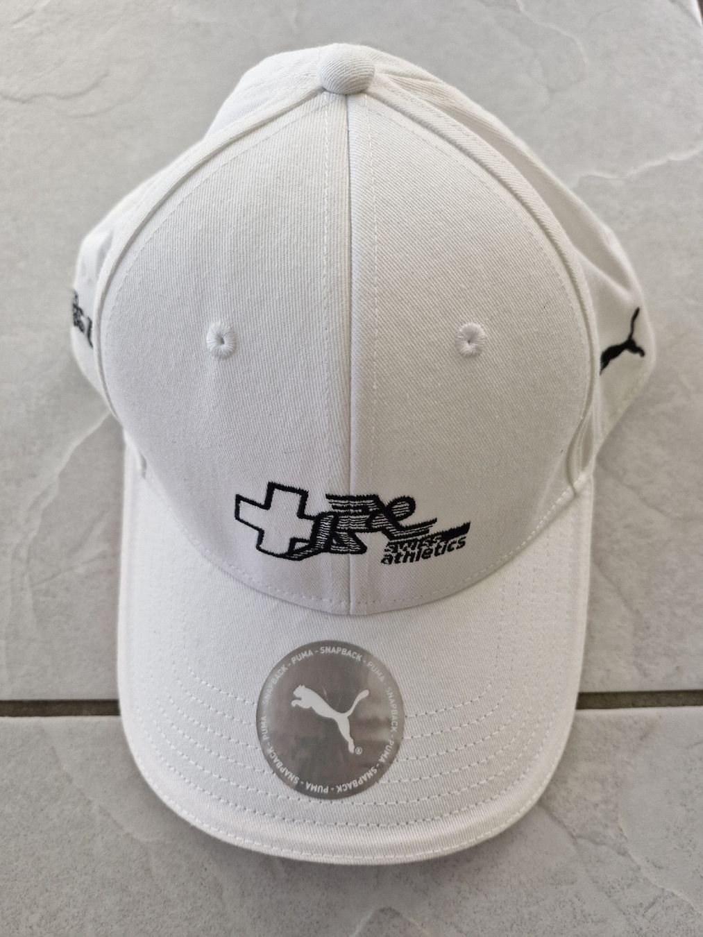 Puma Altro in  Abbigliamento & Accessori: Puma Cap Weiss UBS, Schweizer Meisterschaften, Neu! – Nuovo (secondo la descrizione) da Frauenfeld venduto da Kasico