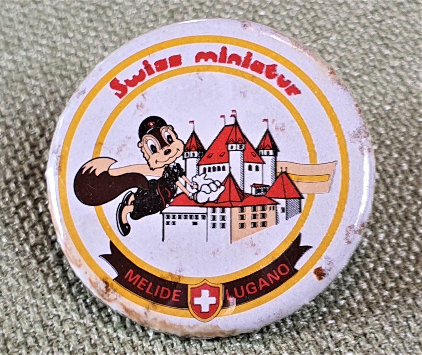 Placchette & Badge: B772 Button Swiss miniatur Melide Lugano – Usato da Reinach BL venduto da Boston-Verkauf