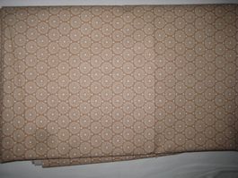 Baumwollstoff hellbraun mit weissen runden Retromotiven