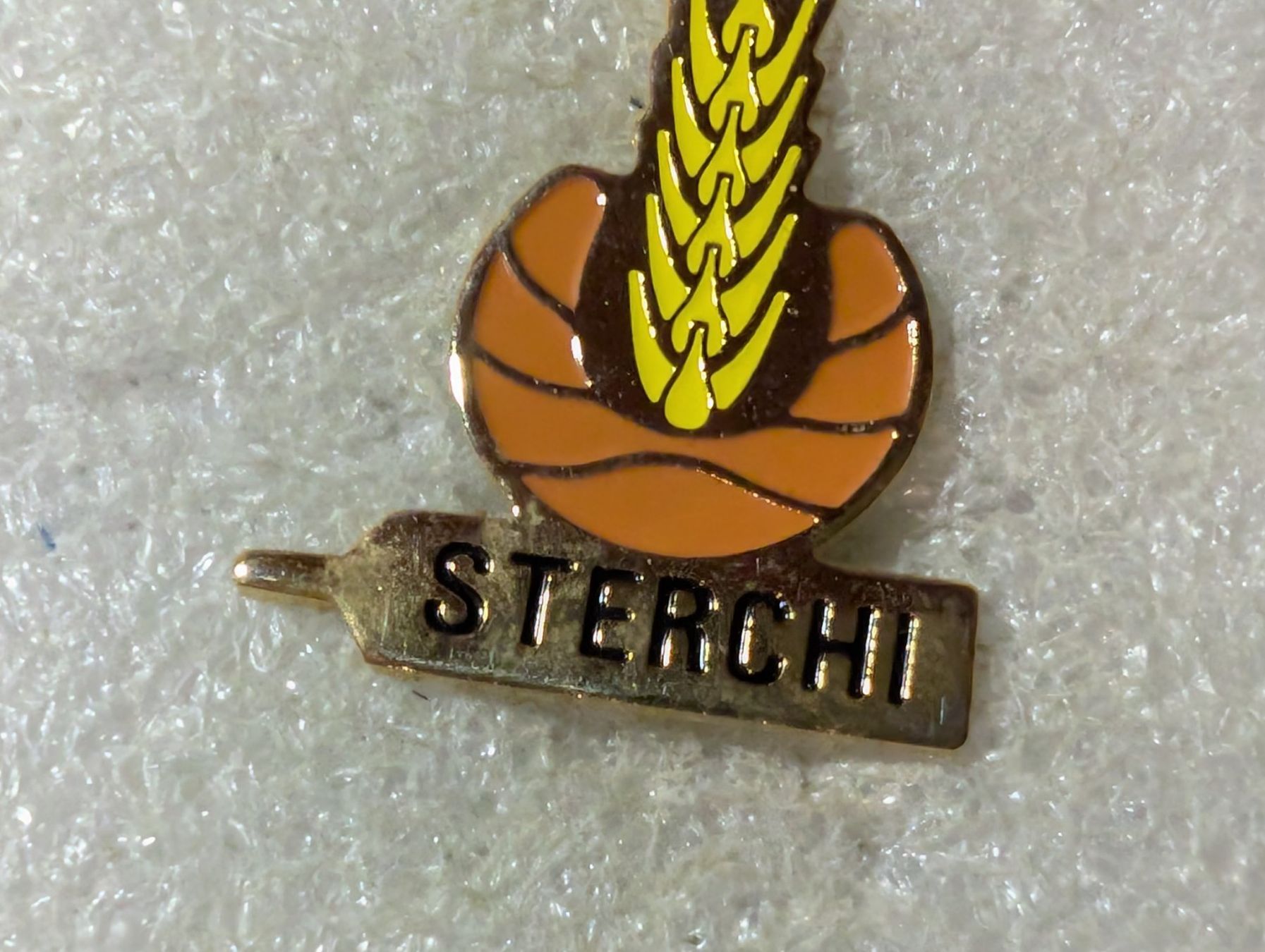 Placchette & Badge: Ansteckpin 117: Sterchi – Usato da Oppligen venduto da Pin-Fall-Shop