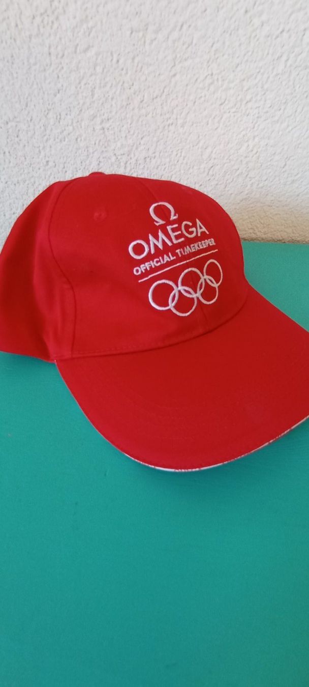 Copricapi, berretti & cappellini: originales Cap OMEGA Official Timekeeper Olympia 2026 – Nuovo (secondo la descrizione) da Pieterlen venduto da reisekultur