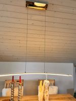 Elegante LED-Pendelleuchte in Bogenform – minimalistisch