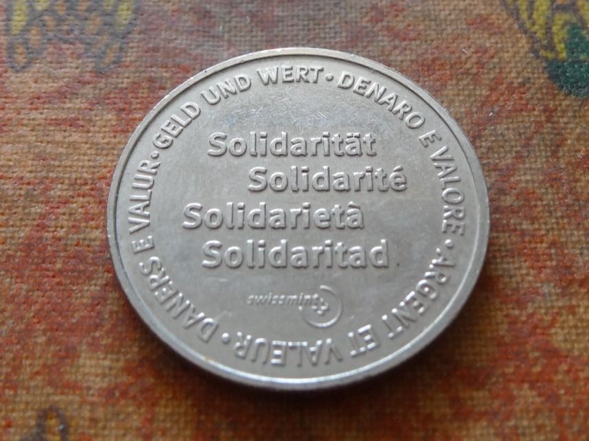 Tutti le monete: Jeton " Solidarité / Argent et valeur  / 1 Solidar "  (F) – Usato da Romanel-sur-Lausanne venduto da Swift13
