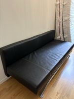 Schwarzes Kunstleder-Bettsofa mit Stauraum