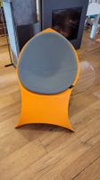 Chaise design FLUX + coussin, orange rare, pliable envelop.