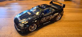 Spielzeugauto Nissan Skyline GT-R schwarz 1/24