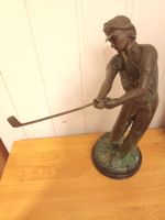 Golfing statue in Bronze no signature. Around 30 cms high.