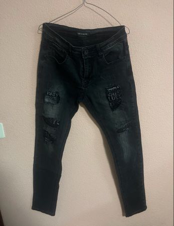 Jeans neri strappati Uomo - Taglia 32 - Look di tendenza!