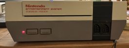 Nintendo Entertainment System mit Spielen und Zubehoer