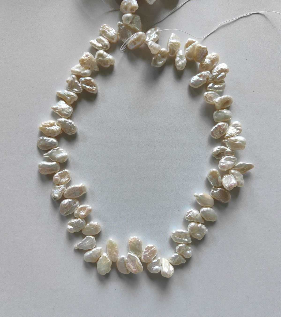 Perle (finte): Süsswasserperle, Keshi ca.10x12mm, weiss – Nuovo e nell'imballaggio originale da Rümlang venduto da 21f