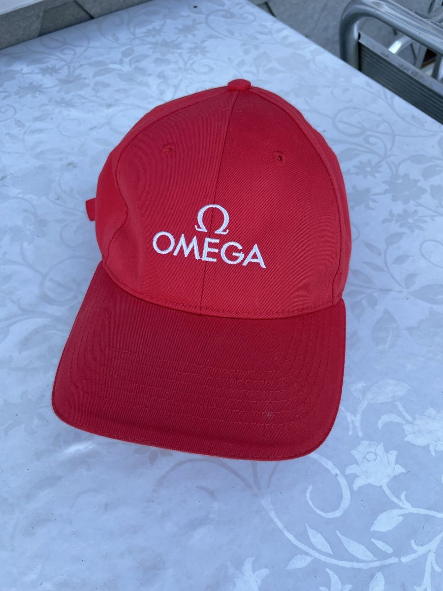 Copricapi, berretti & cappellini: Casquette Oméga rouge – Usato da Biel/Bienne venduto da Galaq