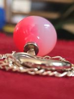 Pendule Quartz rose et argent 925, avec sa pochette.
