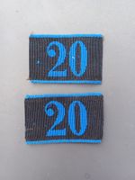 2 Achselnummern 1875/98, blaue 20 auf schwarzem Grund