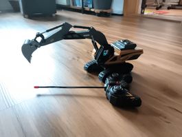 RC Bagger ferngesteuert gelb mit Fernbedienung guter Zustand