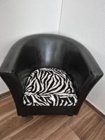 Schwarzer Sessel mit Zebra Kissen - Top Zustand!
