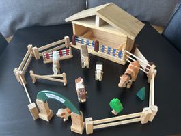 Tierstall mit Tieren und Zaun aus Holz