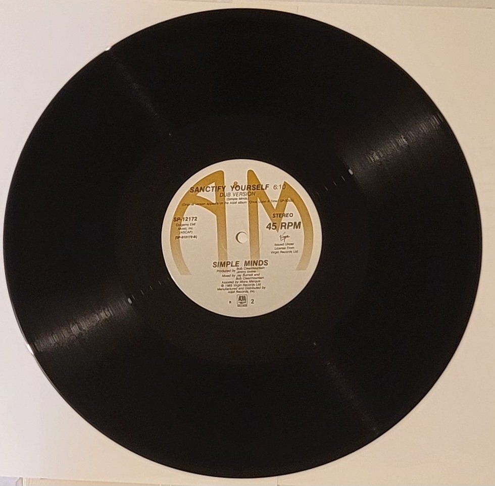 Dischi in vinile: Simple Minds – Sanctify Yourself – Usato da Zürich venduto da Avd 2