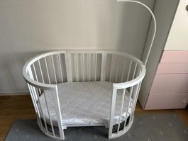 Oval baby bed