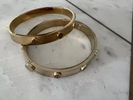 2 Tory Burch logo stud bracelets