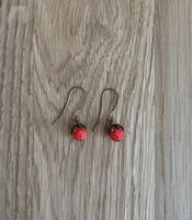 dangly floral earrings, poppy red