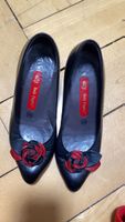Black Hush Puppies Heels with roses 
